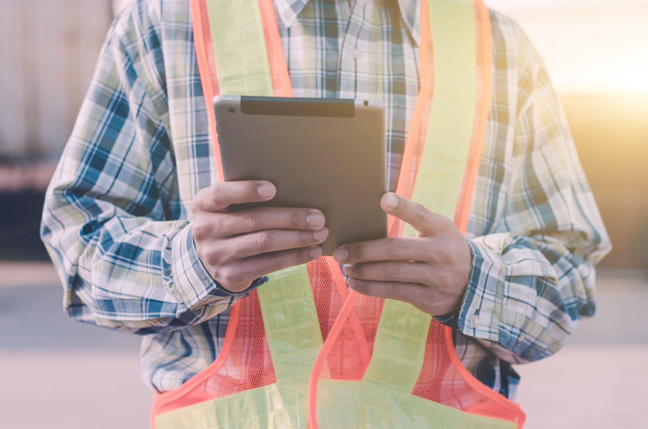 Young Engineer holding and using a digital tablet